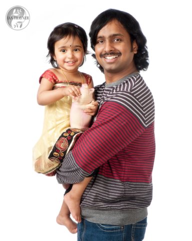 father and daughter photographed against white background
