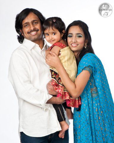 happy Indian family with cute daughter
