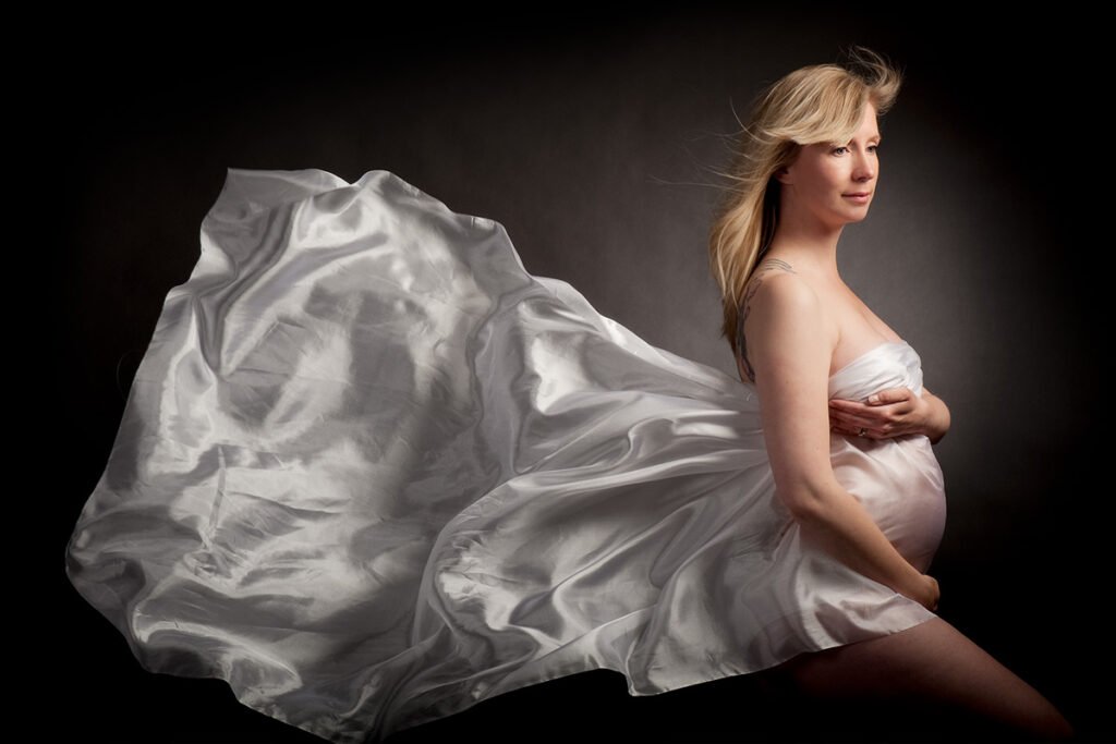 artistic maternity photography, billowing cloth drape