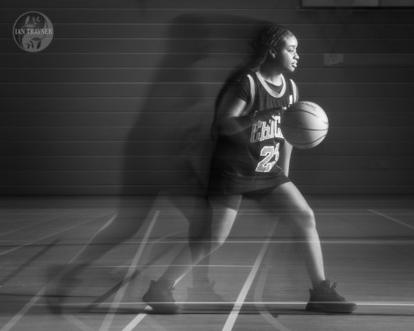 Dynamic basketball action captured in a still image. Photography method: rear curtain sync