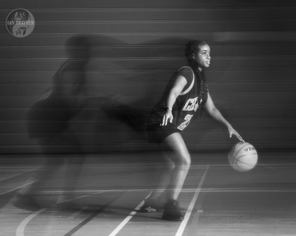 Dynamic basketball action captured in a still image. Photography method: rear curtain sync