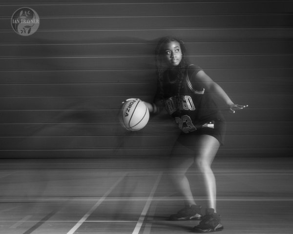 Dynamic basketball action captured in a still image. Photography method: rear curtain sync